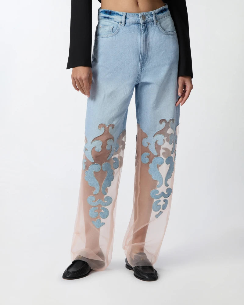 Denim jeans with applique and organza