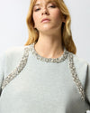 Grey sweatshirt with bejeweled embellishment