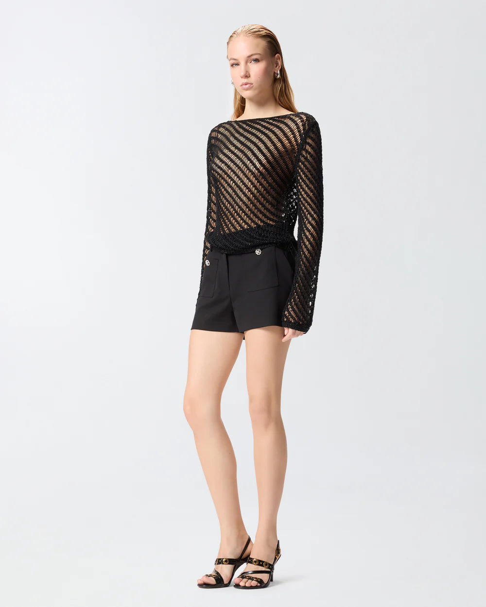 Black shorts with flower buttons