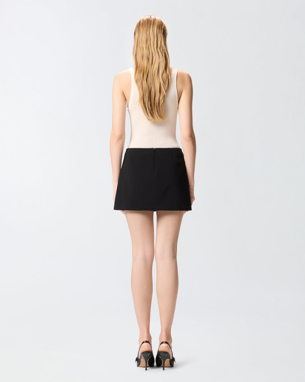 Black mini skirt with embroidered rose applique