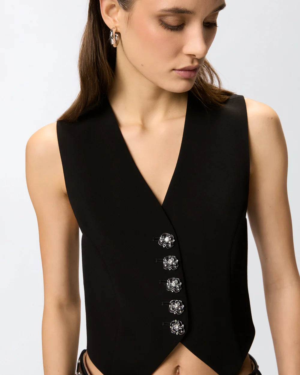 Black vest with rose buttons