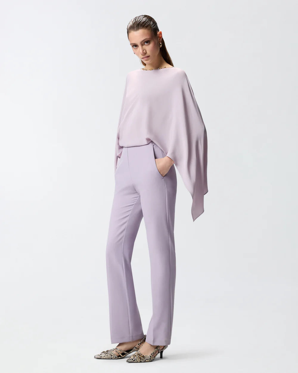 Lilac jumpsuit with open back and jeweled necklace