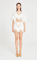 White Lace Mini Skirt With Gold Eyelet Details