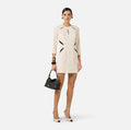 Ivory mini dress with 3/4 sleeves and black insert design