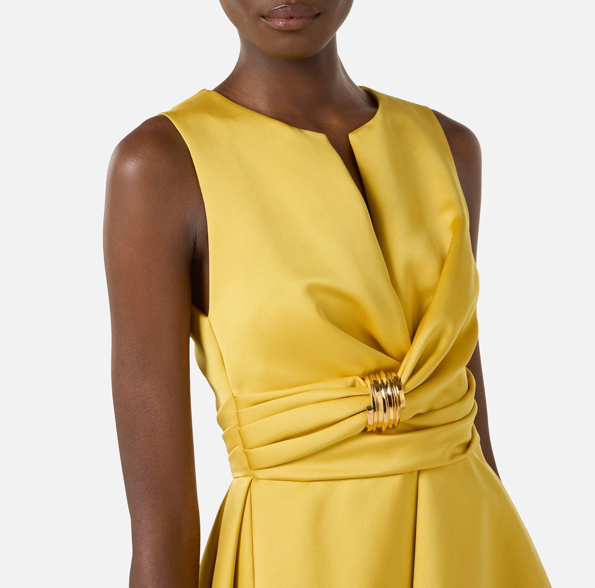 Yellow duchess satin dress with golden jewel
