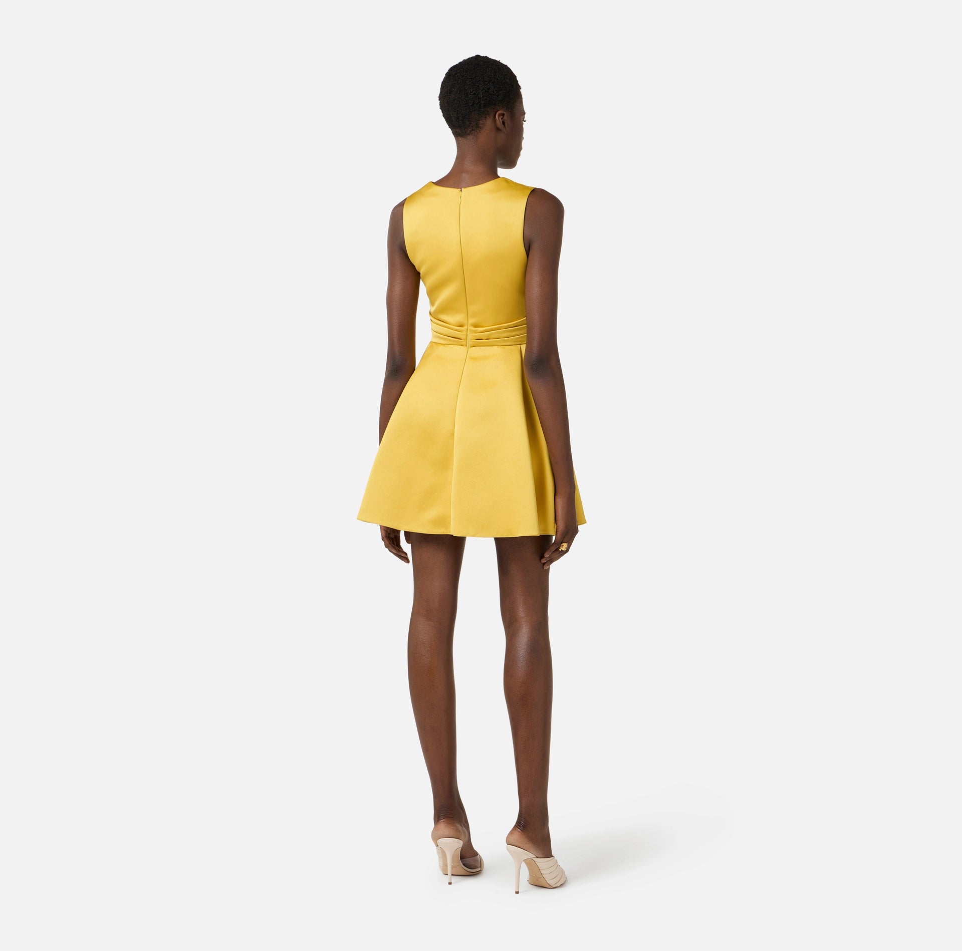Yellow duchess satin dress with golden jewel