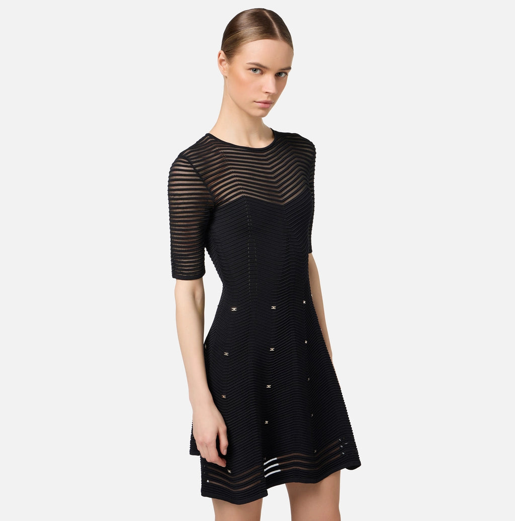 Black herringbone knit mini dress with gold grommet accents