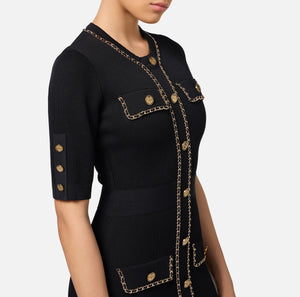 Black mini knit dress with chain embellishment and short sleeves