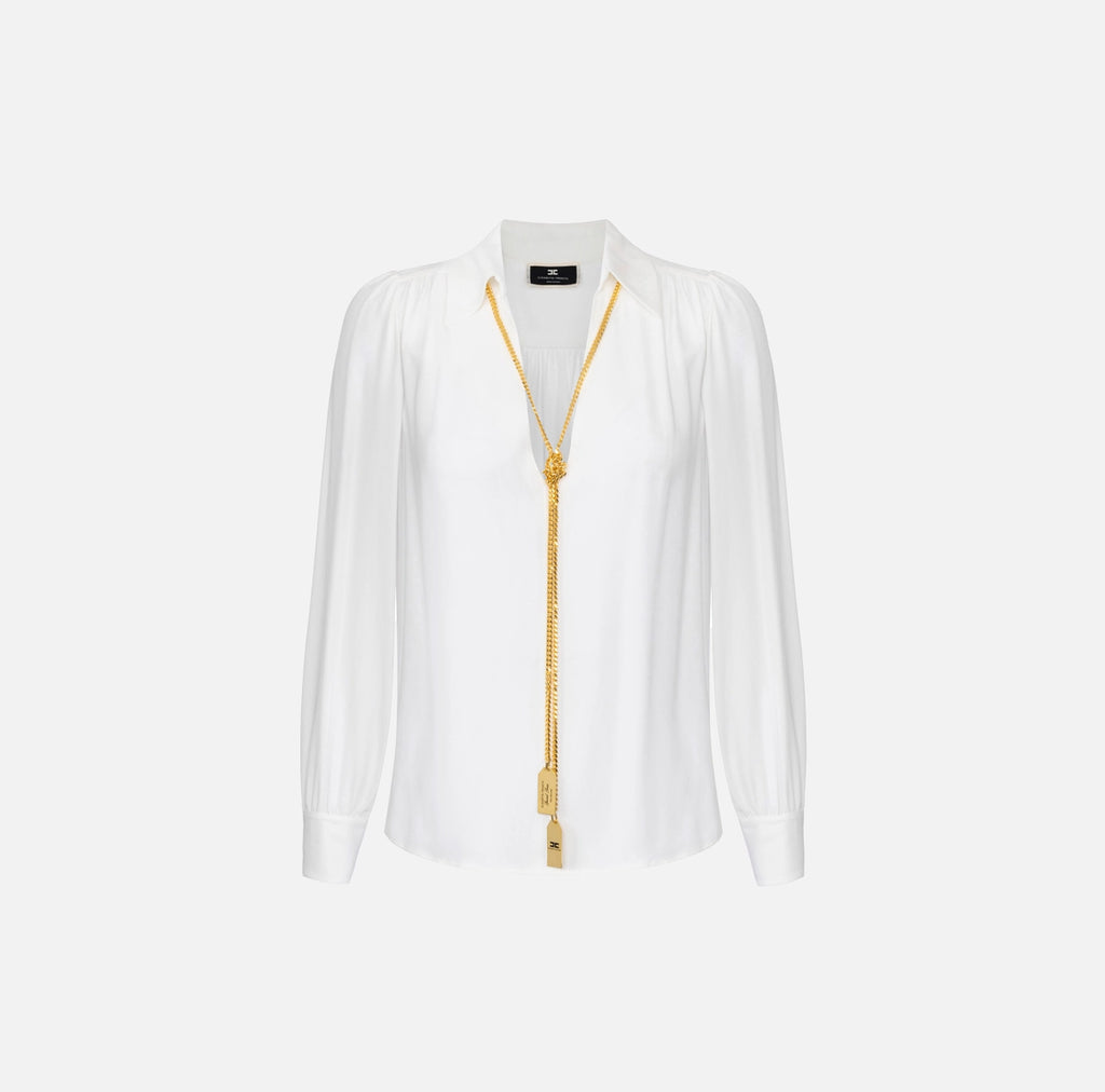 White long sleeve blouse with necklace