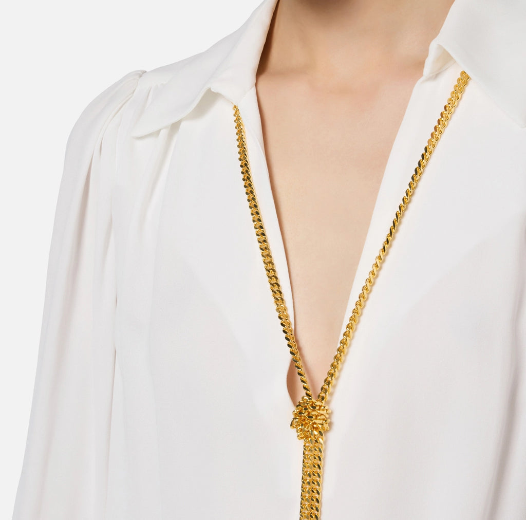 White long sleeve blouse with necklace