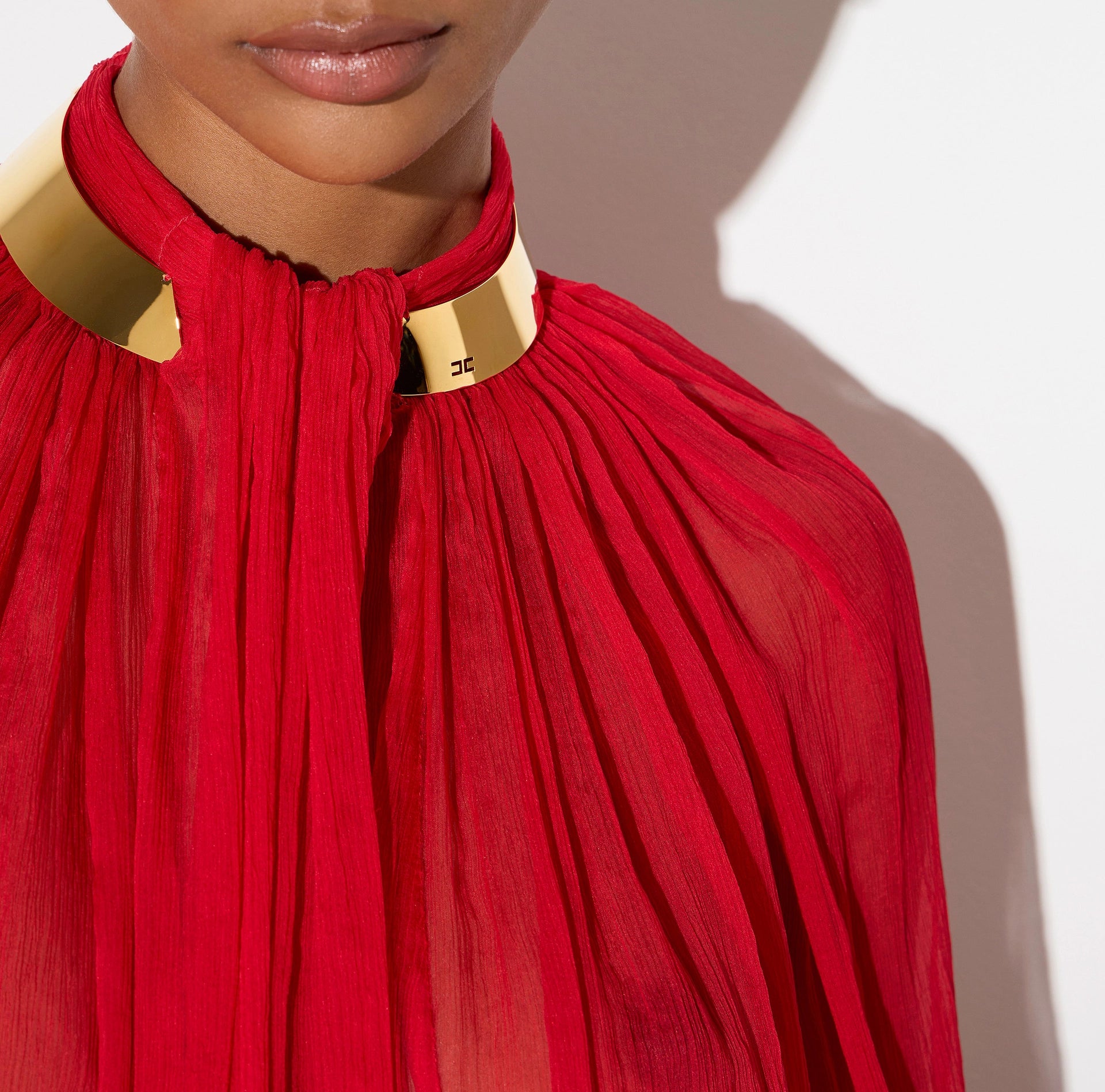 Red chiffon blouse with gold collar