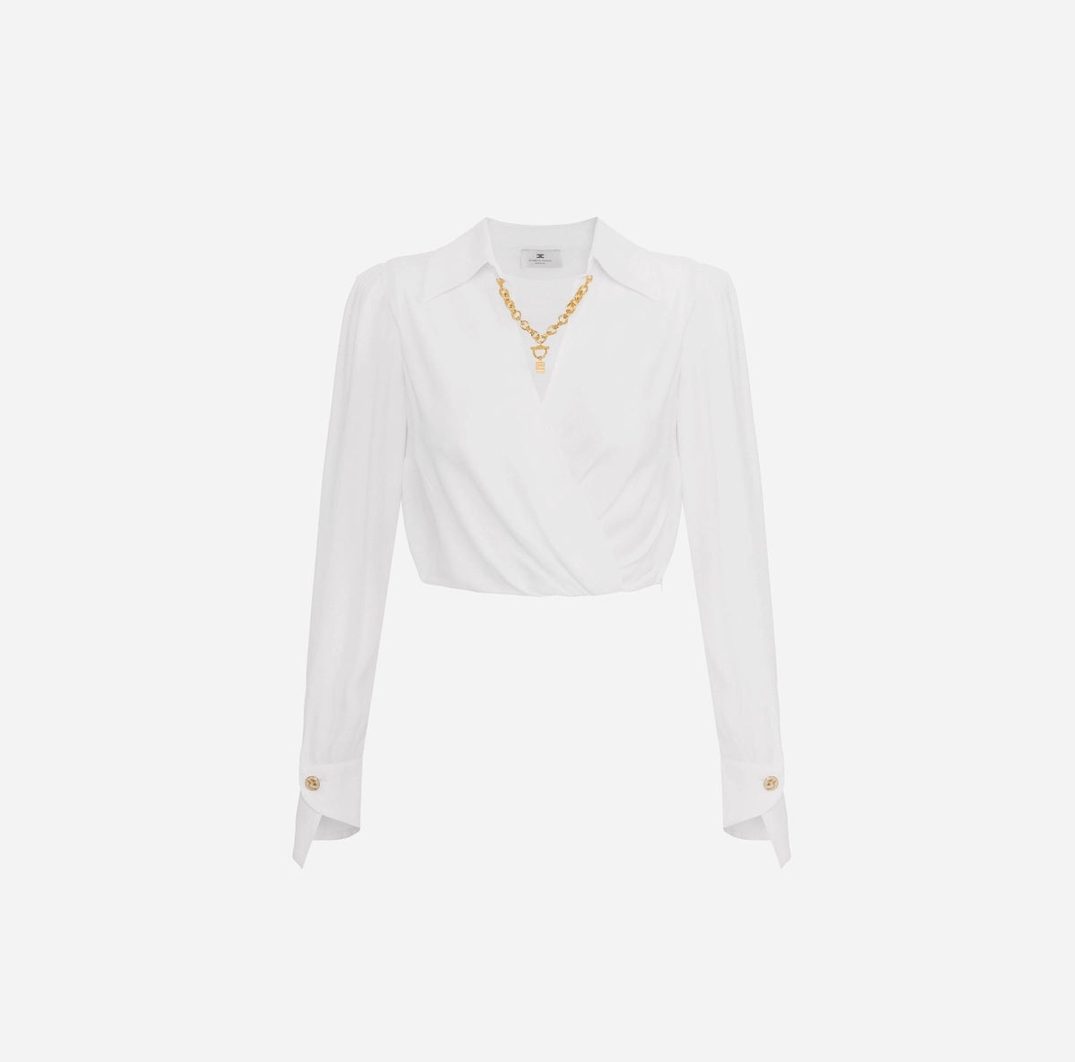 White cropped blouse with long sleeves and gold chain detail