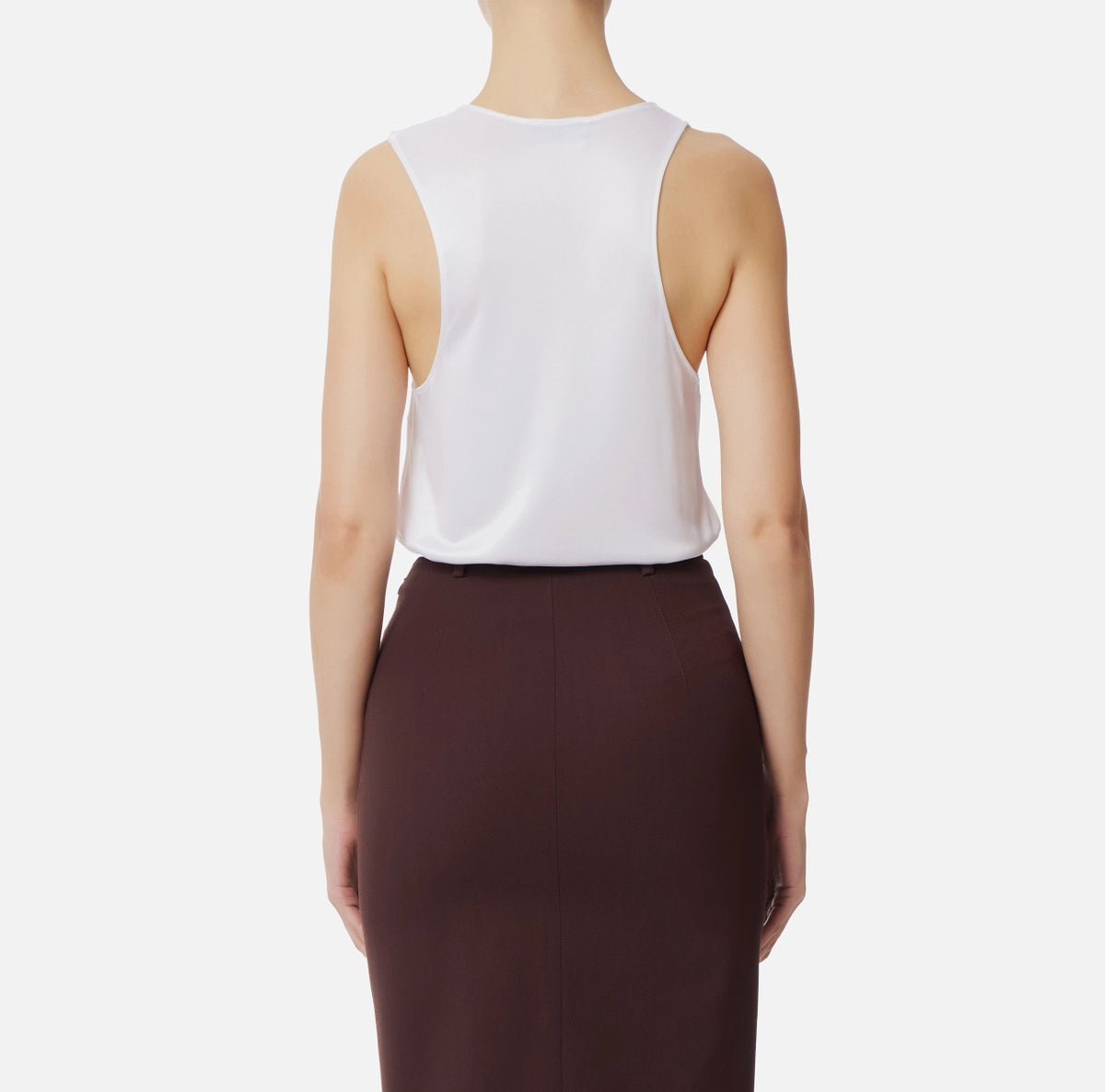 White sleeveless jersey top with gold embelishment