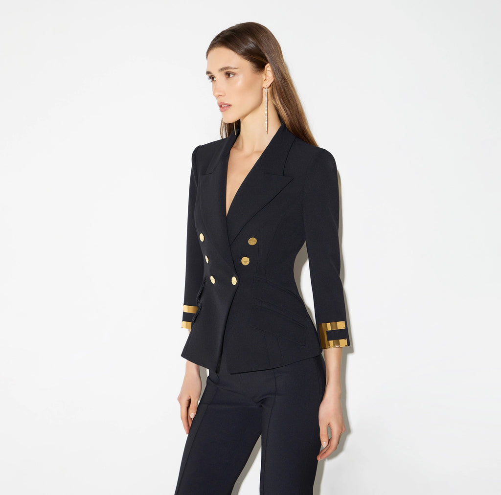 Navy structured jacket with gold buttons and logo details on sleeves