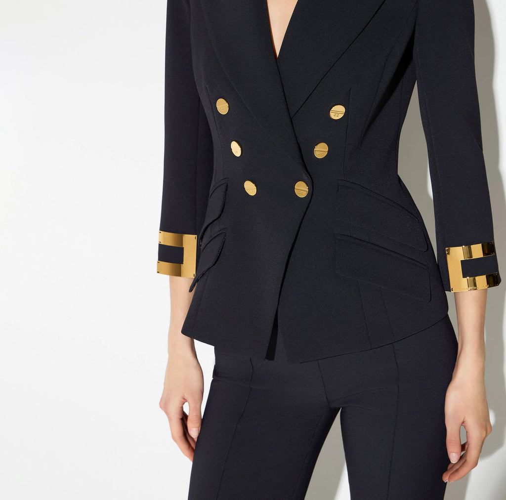 Navy structured jacket with gold buttons and logo details on sleeves