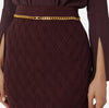 Burgundy knit pencil skirt with gold chain