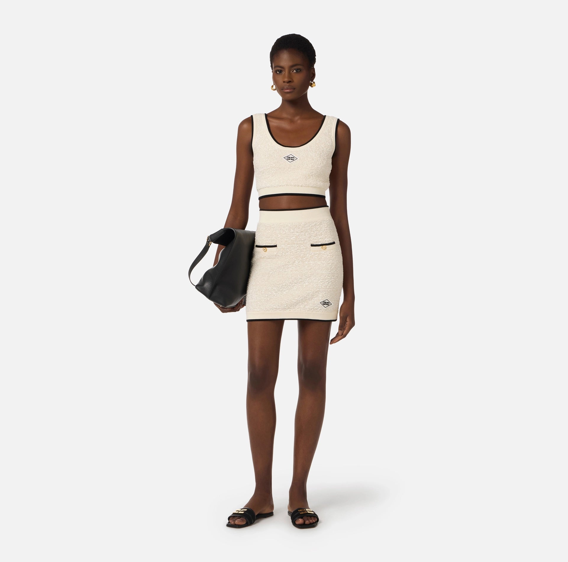 White  with black trim mini skirt in boucle knit