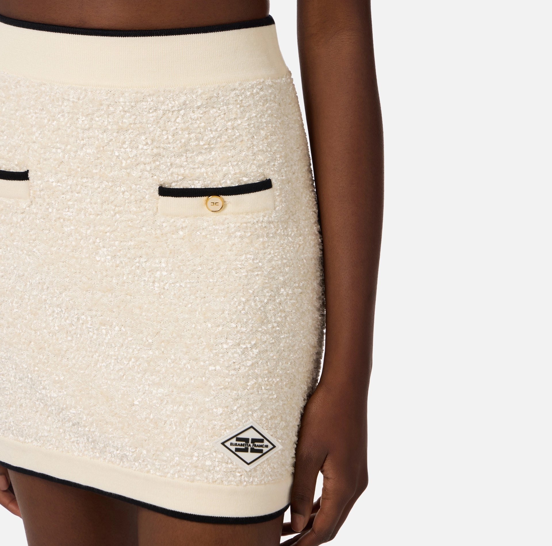 White  with black trim mini skirt in boucle knit