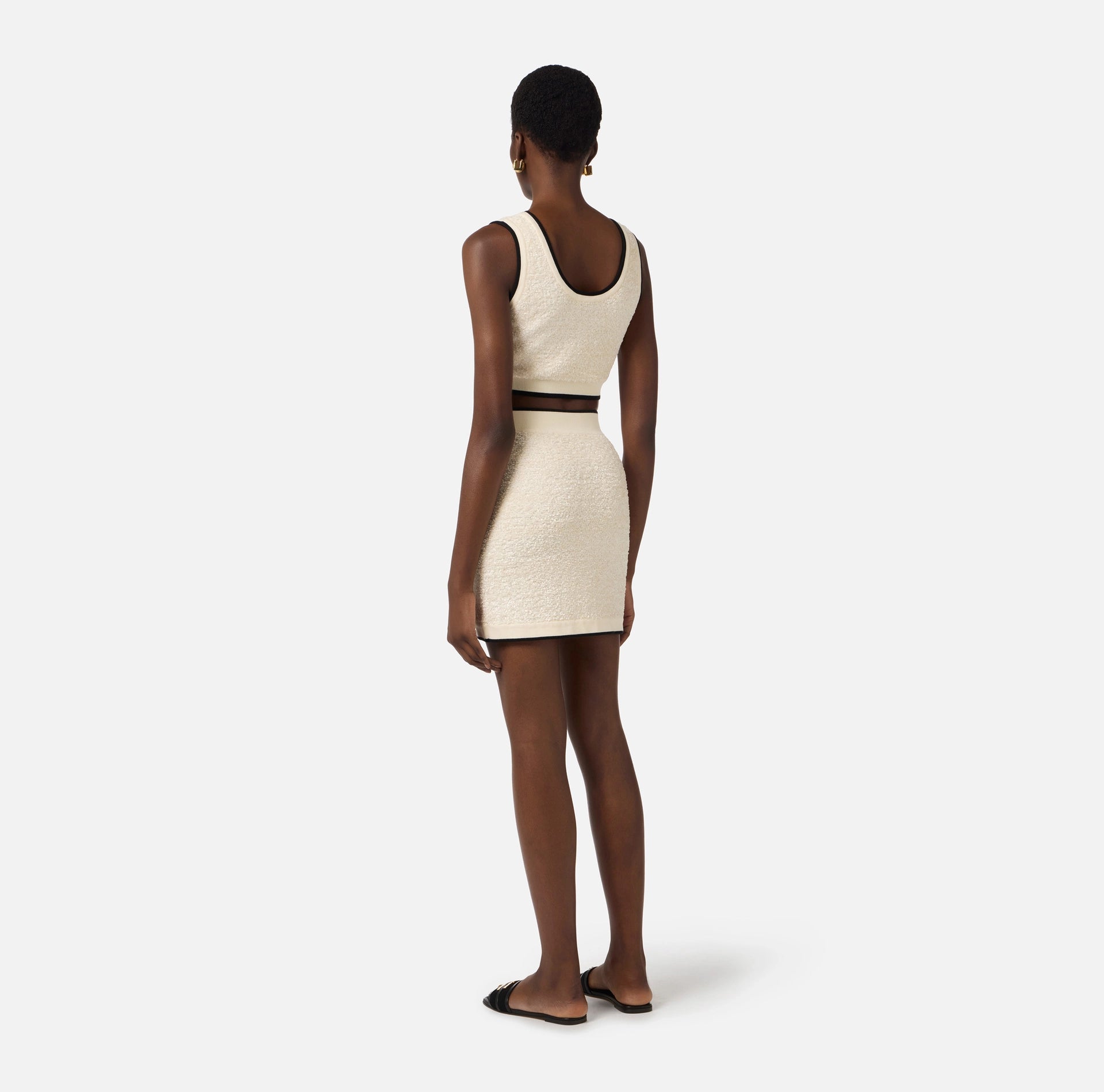 White  with black trim mini skirt in boucle knit