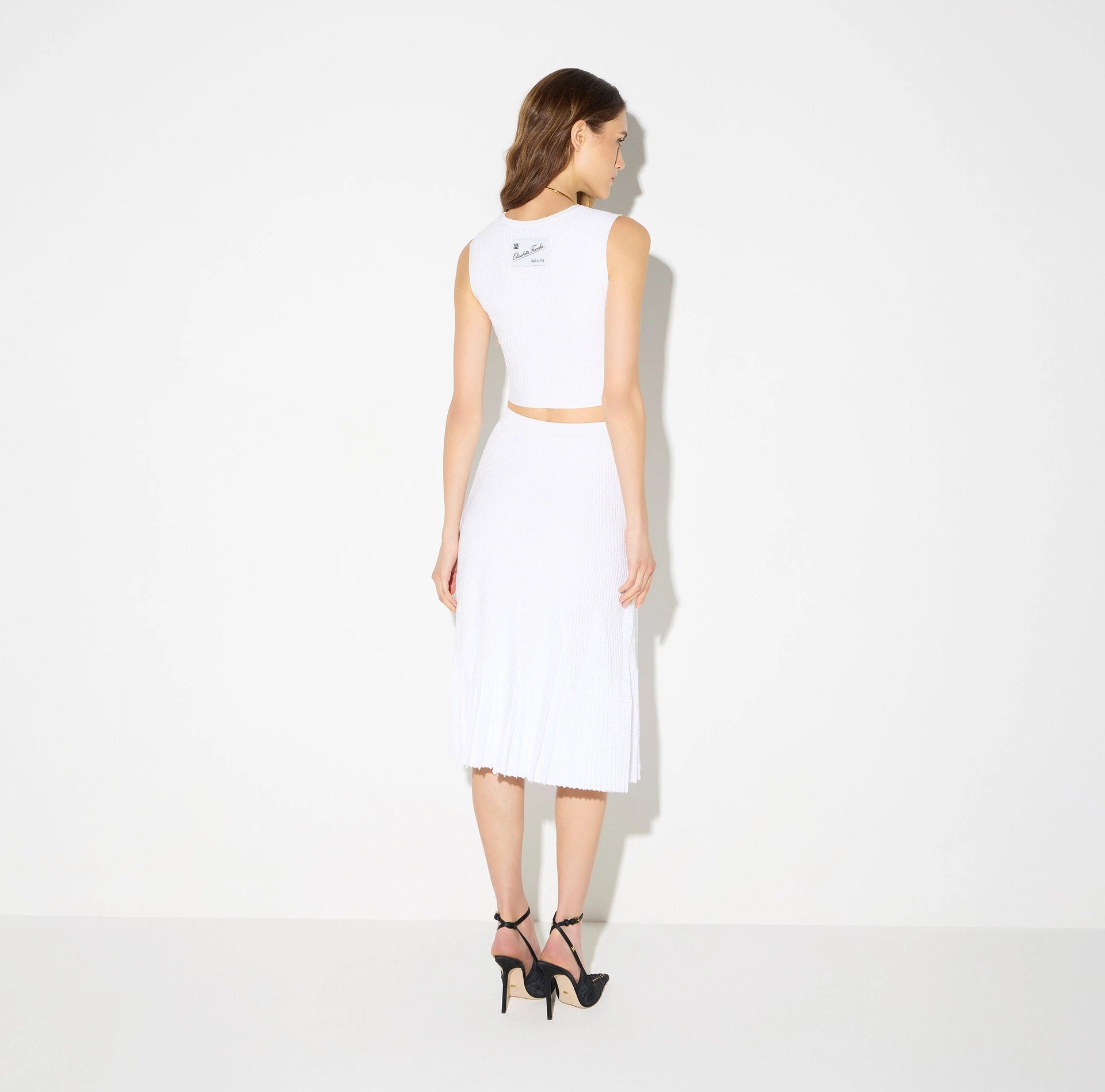 White midi knit skirt with 3D ribbed details