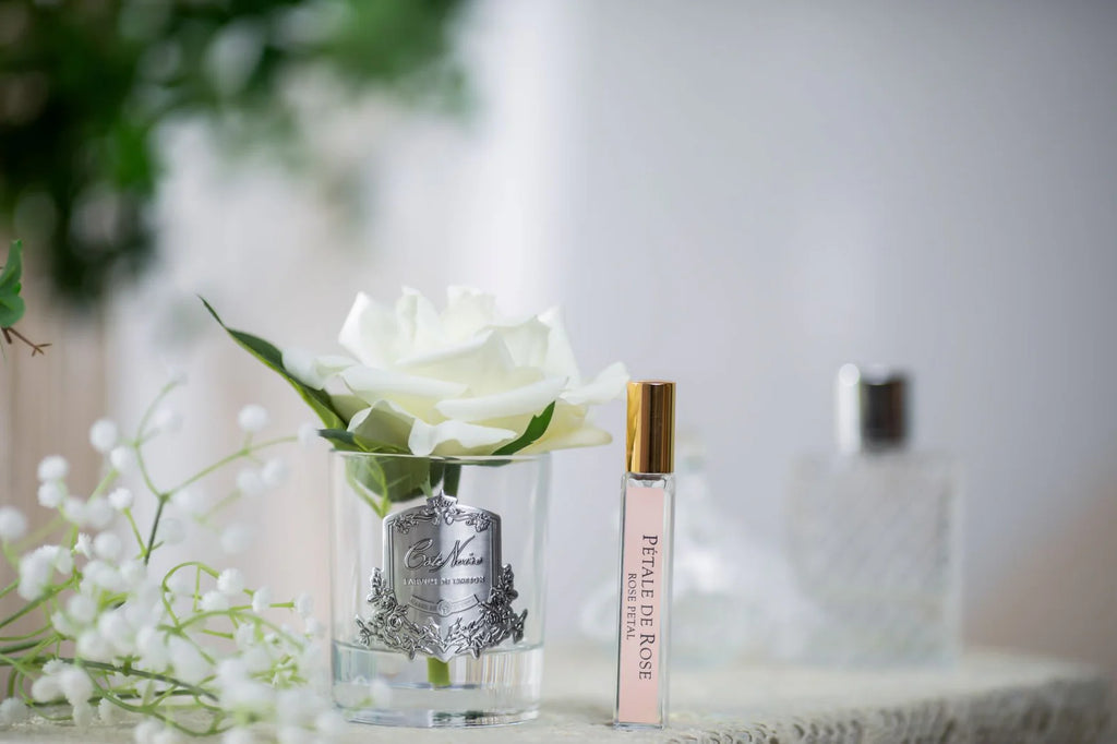 Ivory single rose in a clear glass diffuser