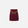 Burgundy mini skirt with chain belt