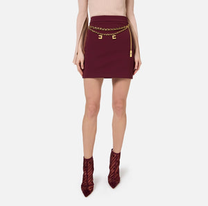 Burgundy mini skirt with chain belt