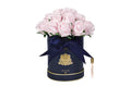 Pink roses in a navy hat box flower diffuser