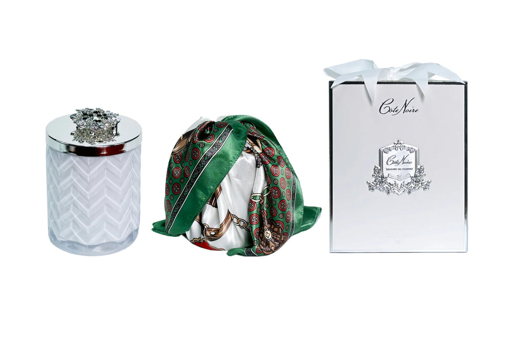 White herringbone candle with silk scarf and a silver broach