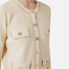 Cream knit short jacket with chain detail and buttons