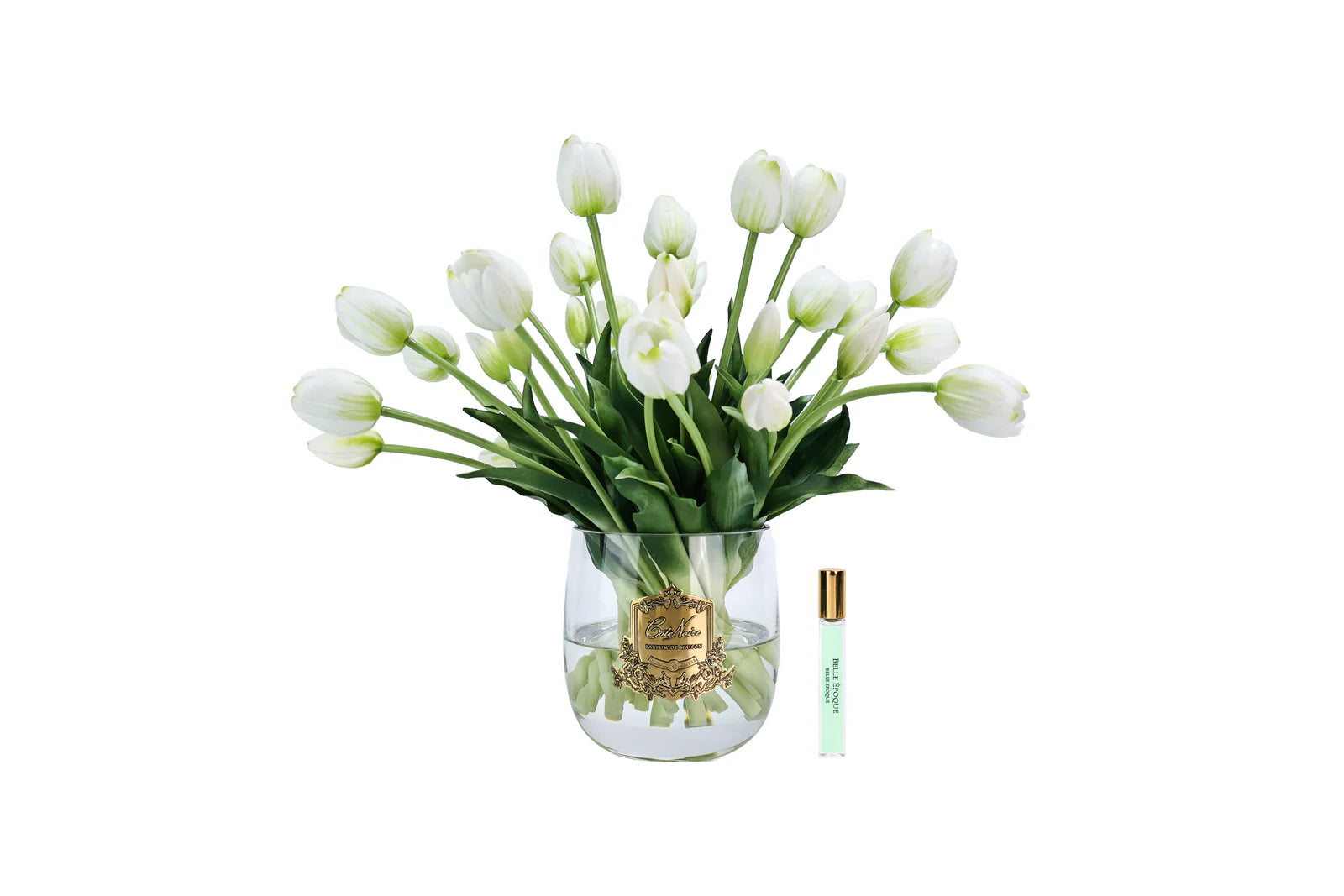 White heritage tulips in a clear vase with gold badge