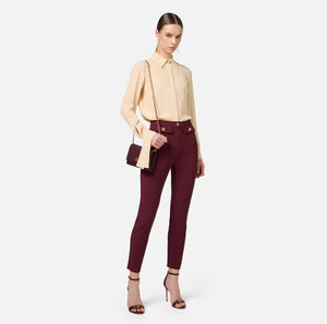 Burgundy ankle straight trousers with gold buttons