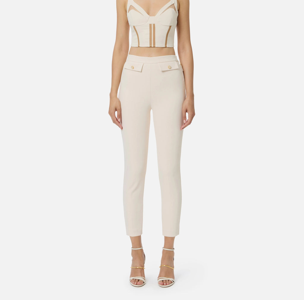 Ivory ankle slim fit pants with decorative pockets