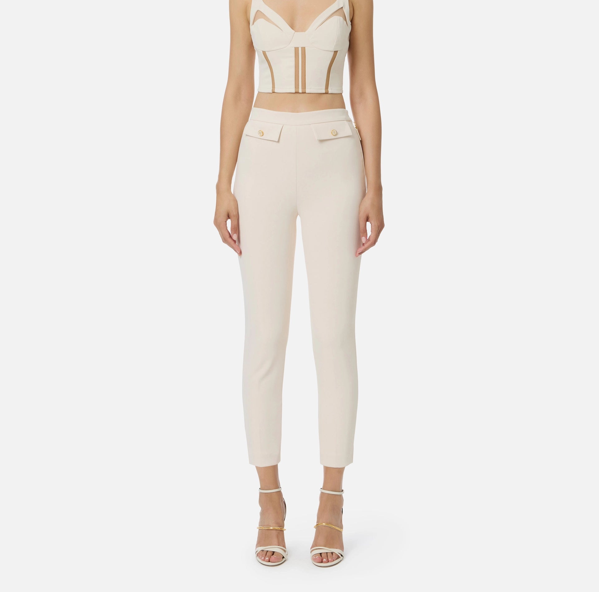 Ivory ankle slim fit pants with decorative pockets