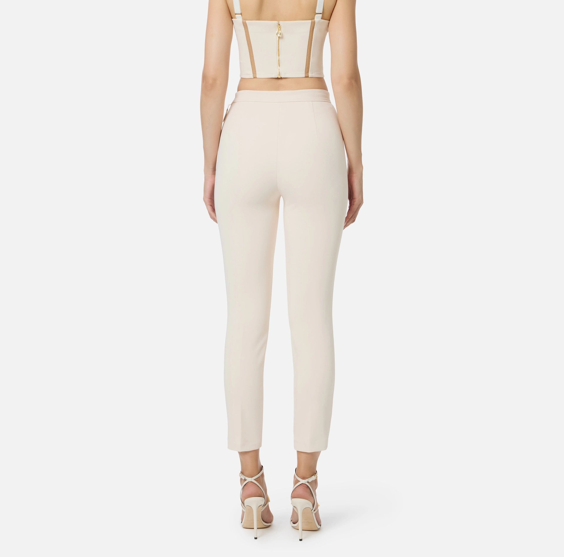 Ivory ankle slim fit pants with decorative pockets