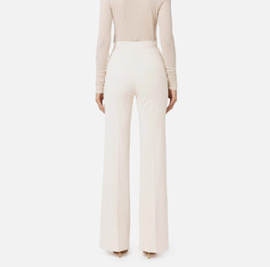 Ivory palazzo trousers with chain belt