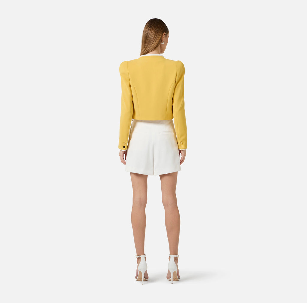 White gabardine shorts with chain