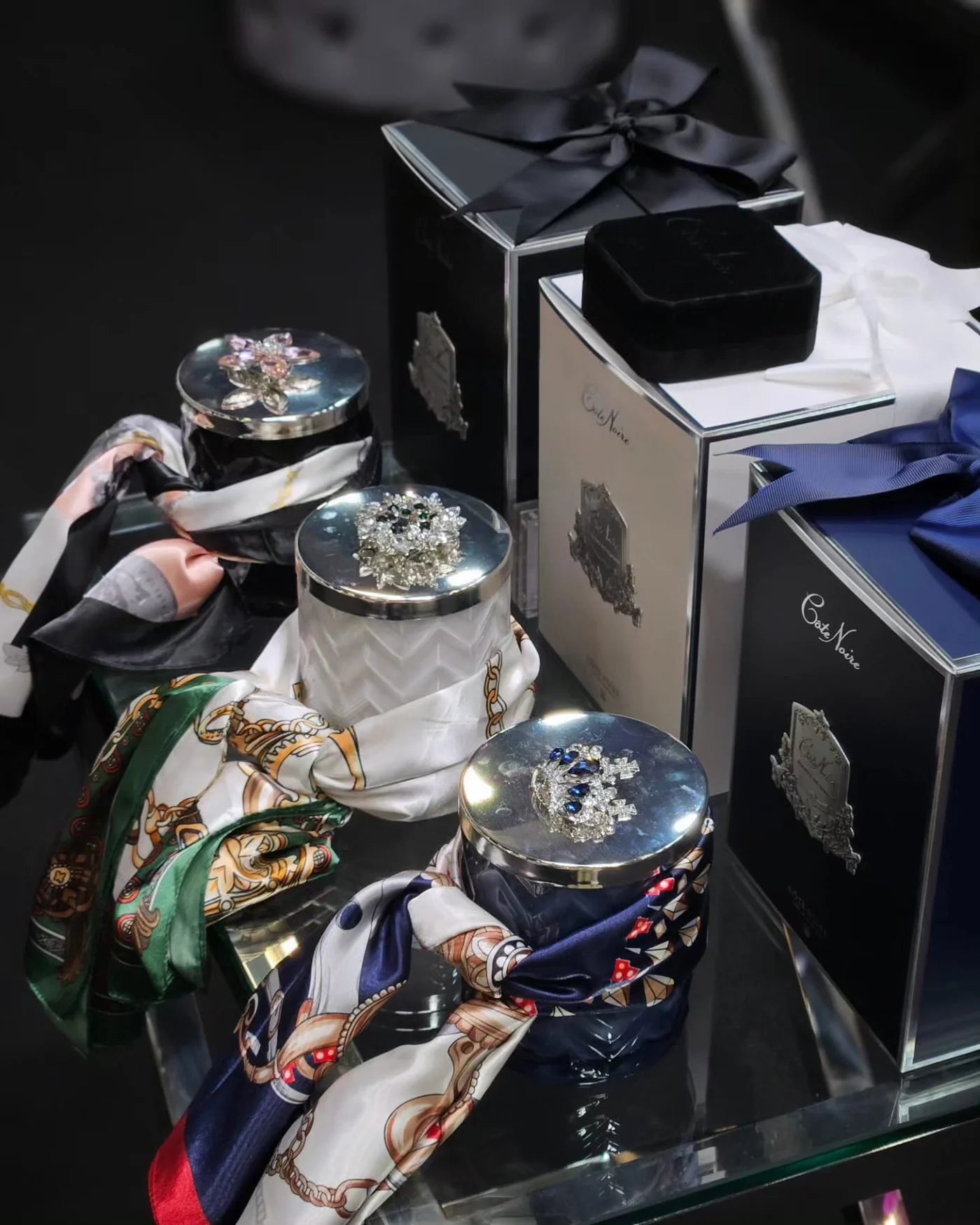 Black herringbone candle with scarf and a flower silver lid broach