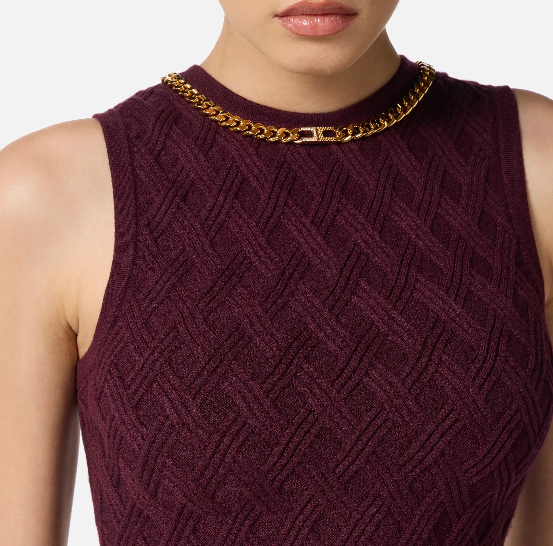 Burgundy knit top with gold chain