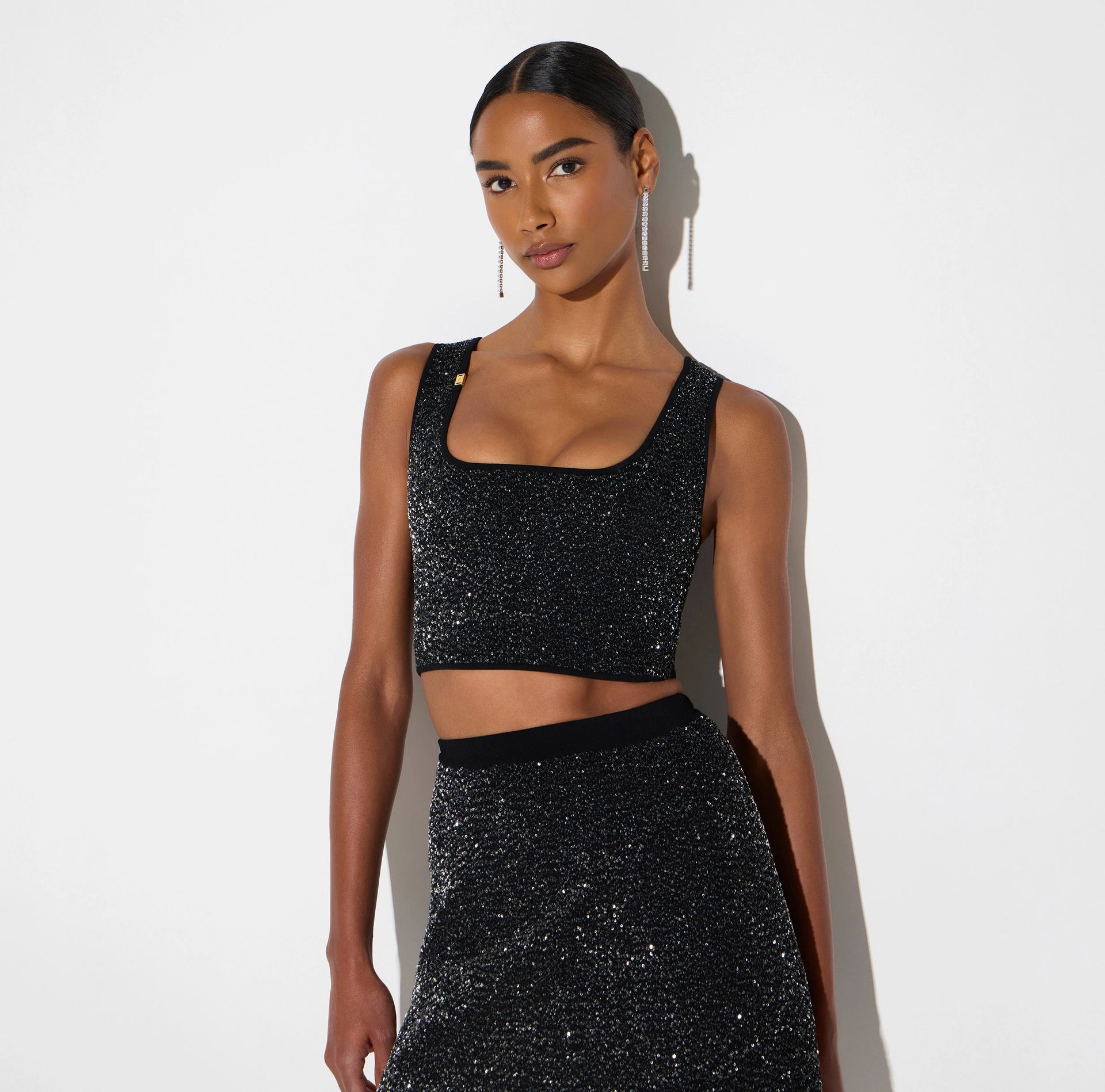 Black knit top with silver sequins