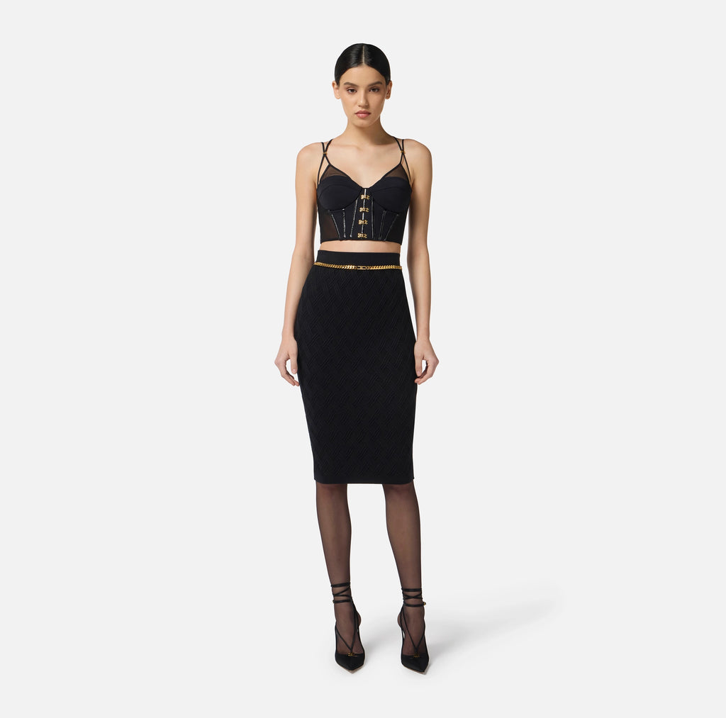 Black top in neoprene fabric with corset details