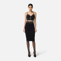 Black top in neoprene fabric with corset details