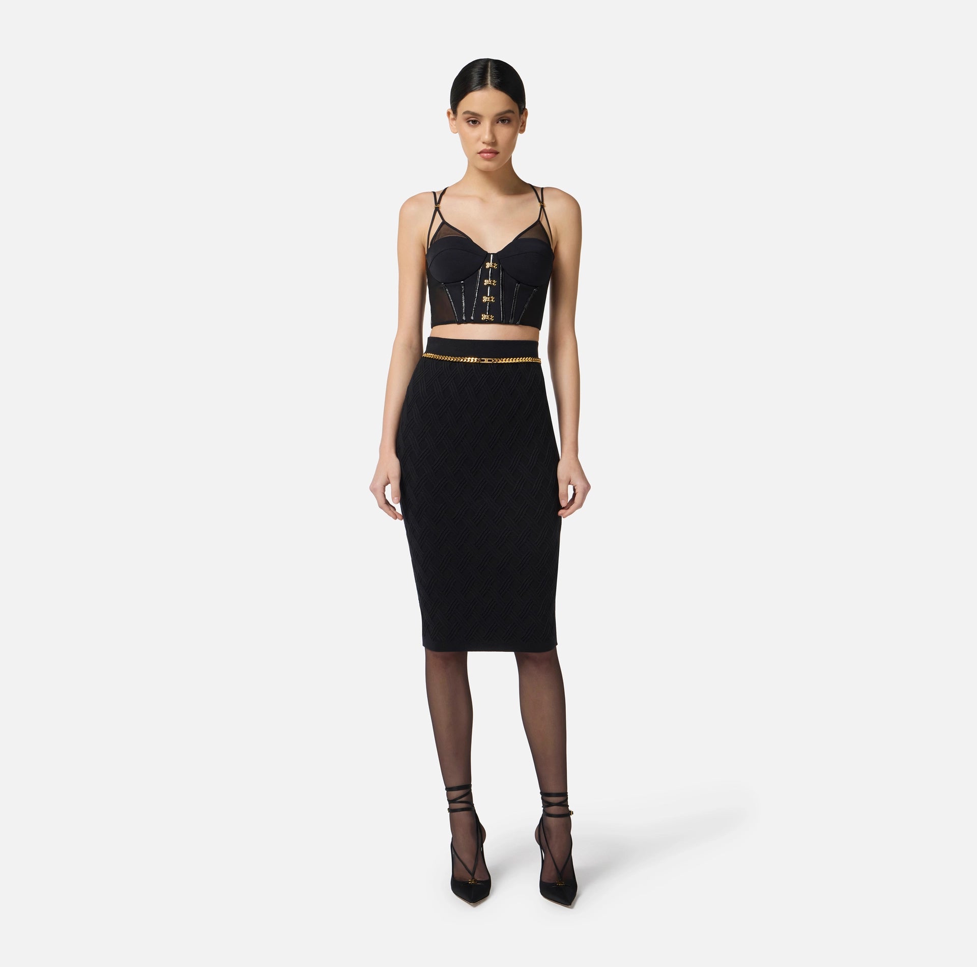 Black top in neoprene fabric with corset details