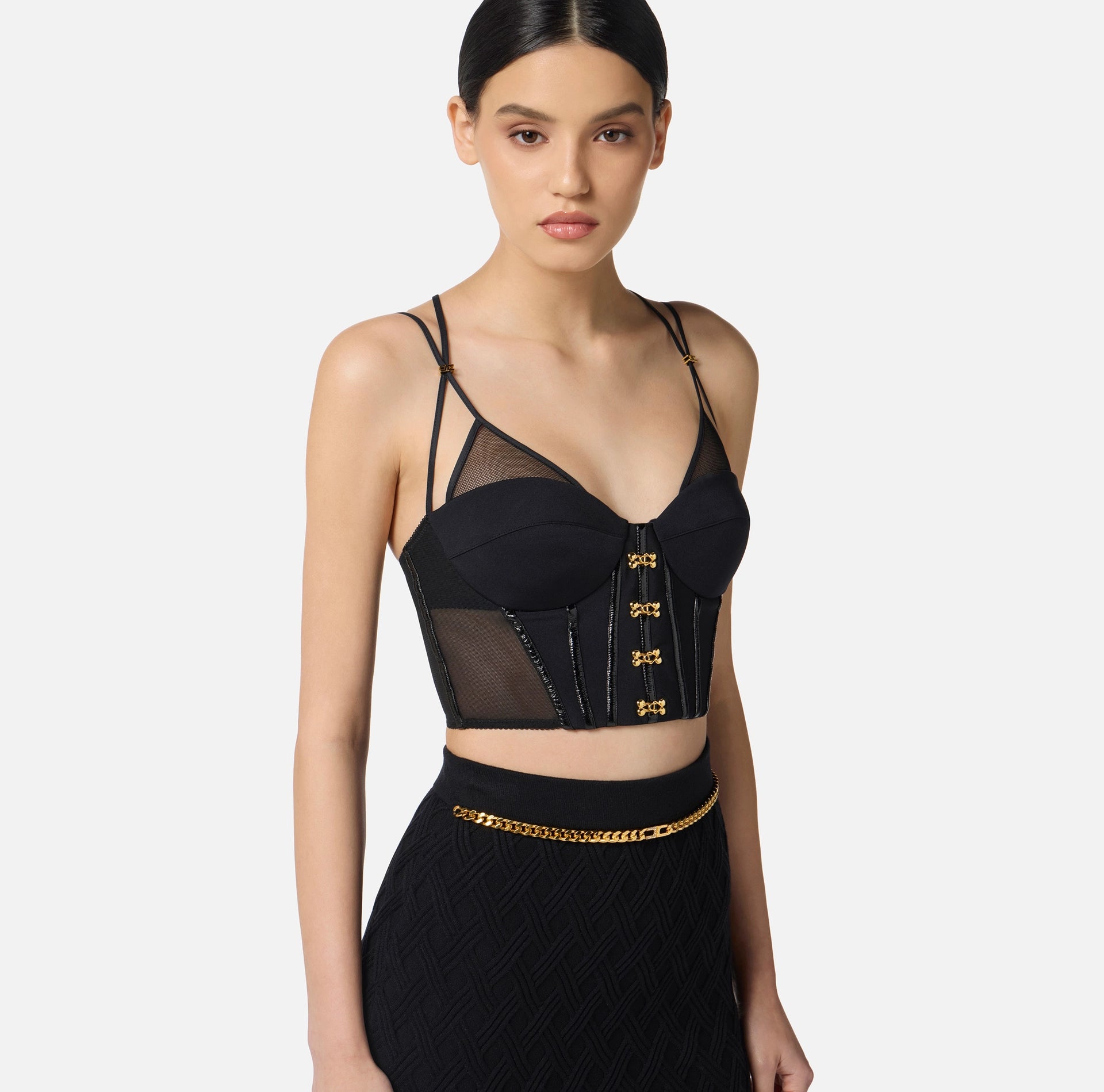 Black top in neoprene fabric with corset details