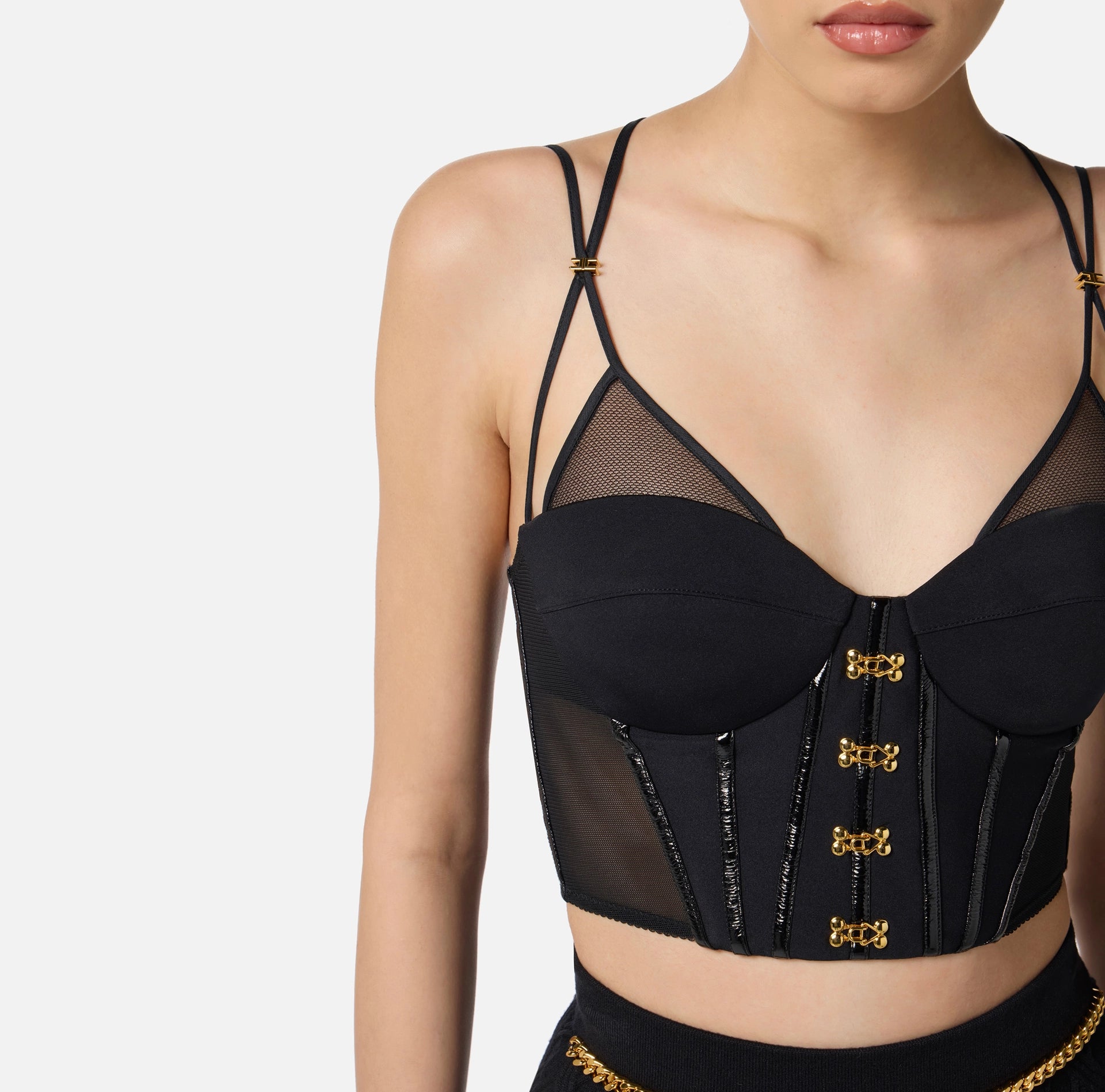 Black top in neoprene fabric with corset details