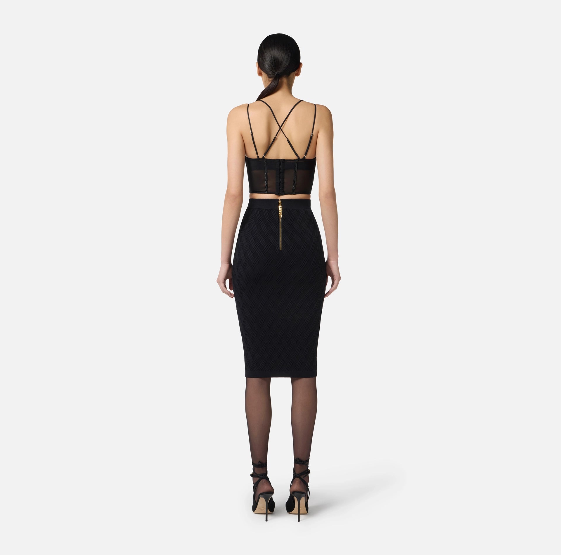 Black top in neoprene fabric with corset details