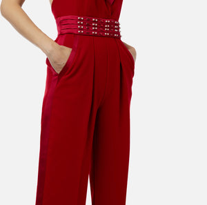 Red halter neck jumpsuit with embroidered waistband