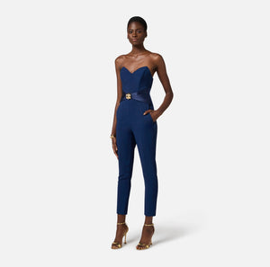 Navy strapless jumpsuit with satin bow and gold decoration