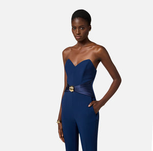 Navy strapless jumpsuit with satin bow and gold decoration