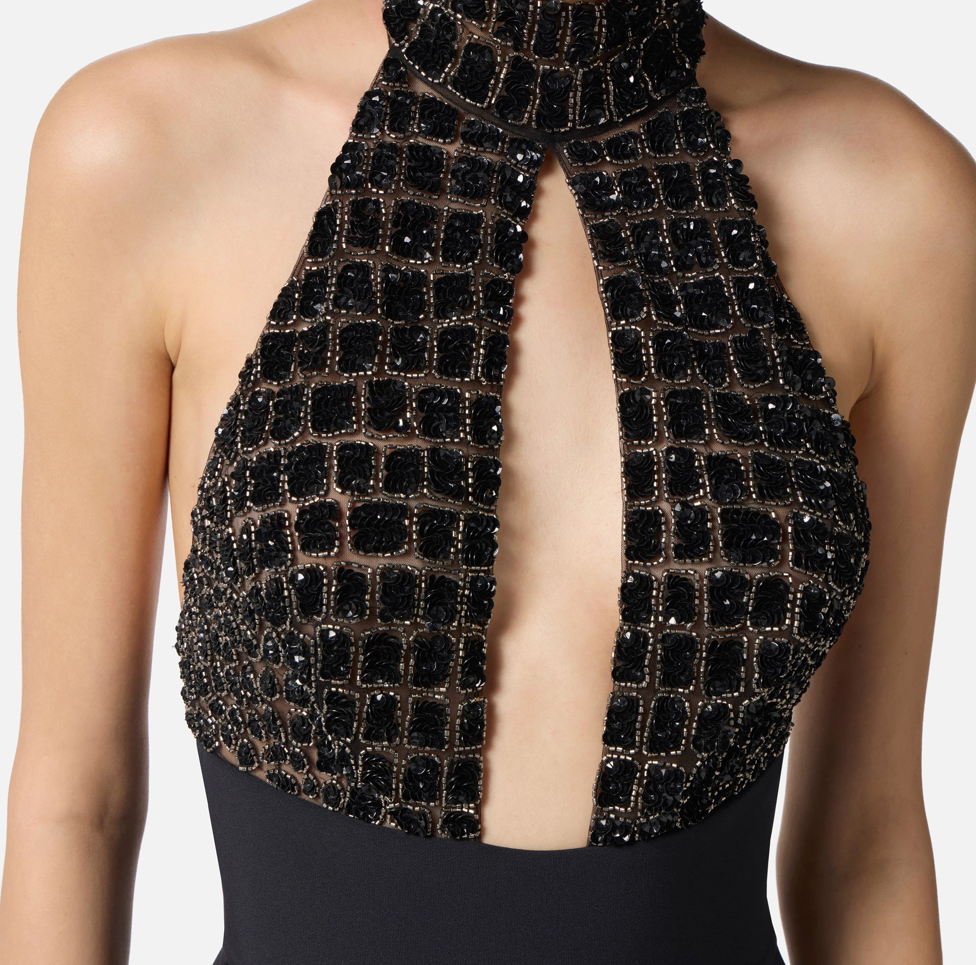 Black jumpsuit in tulle with crocodile embroideries